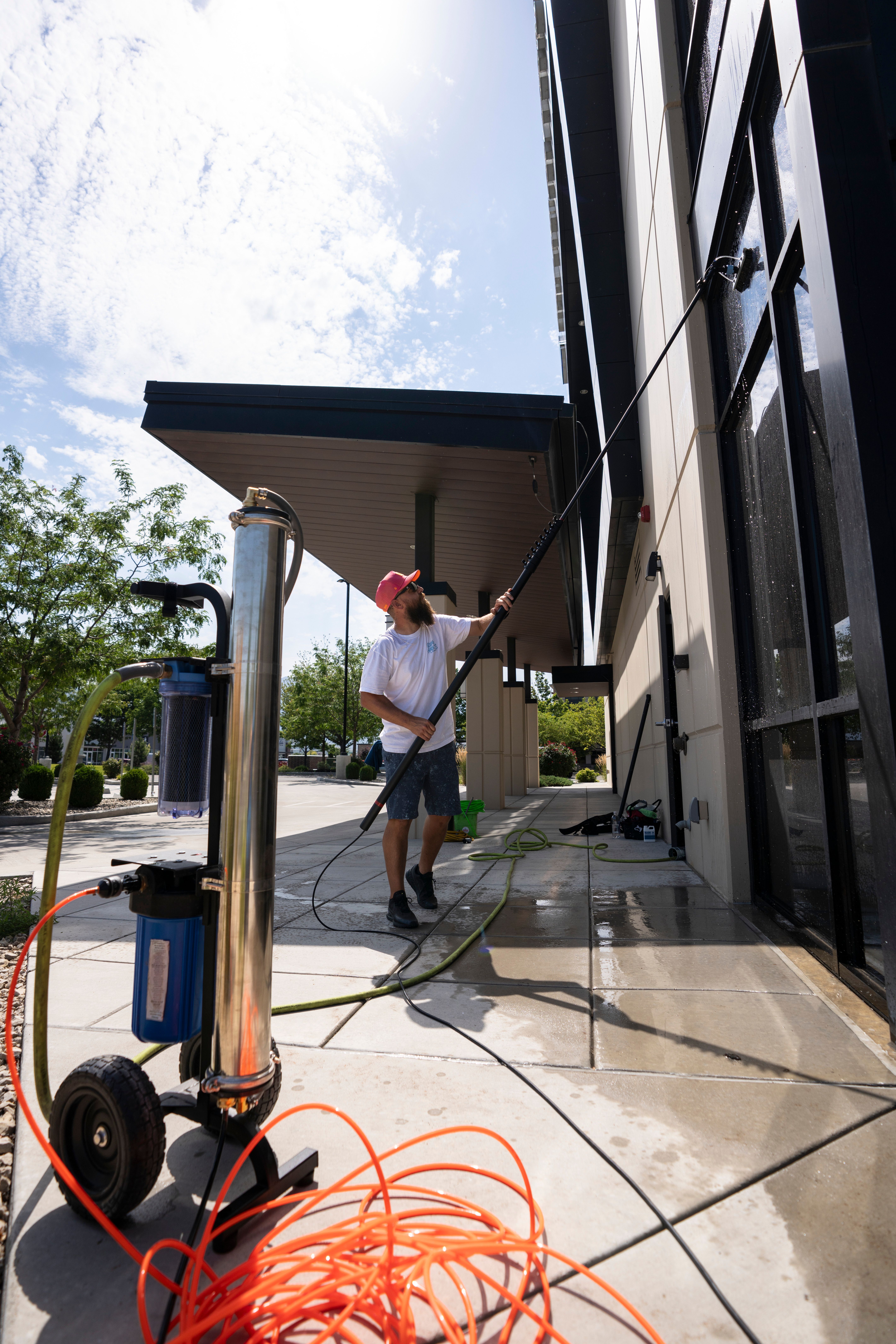 Window cleaner using a water-fed pole beside a pure water system