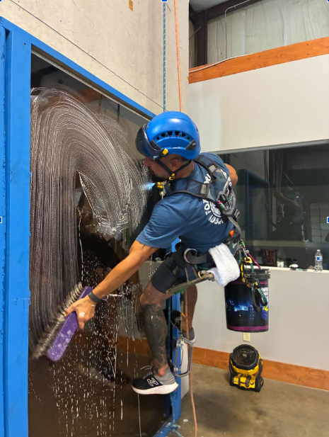 Hands-on window cleaning instruction at the At Height Training facility